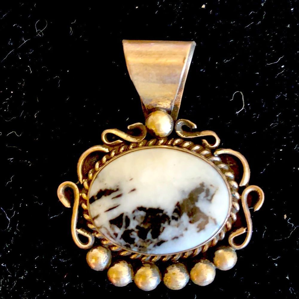 Sterling pendant with Genuine stone.